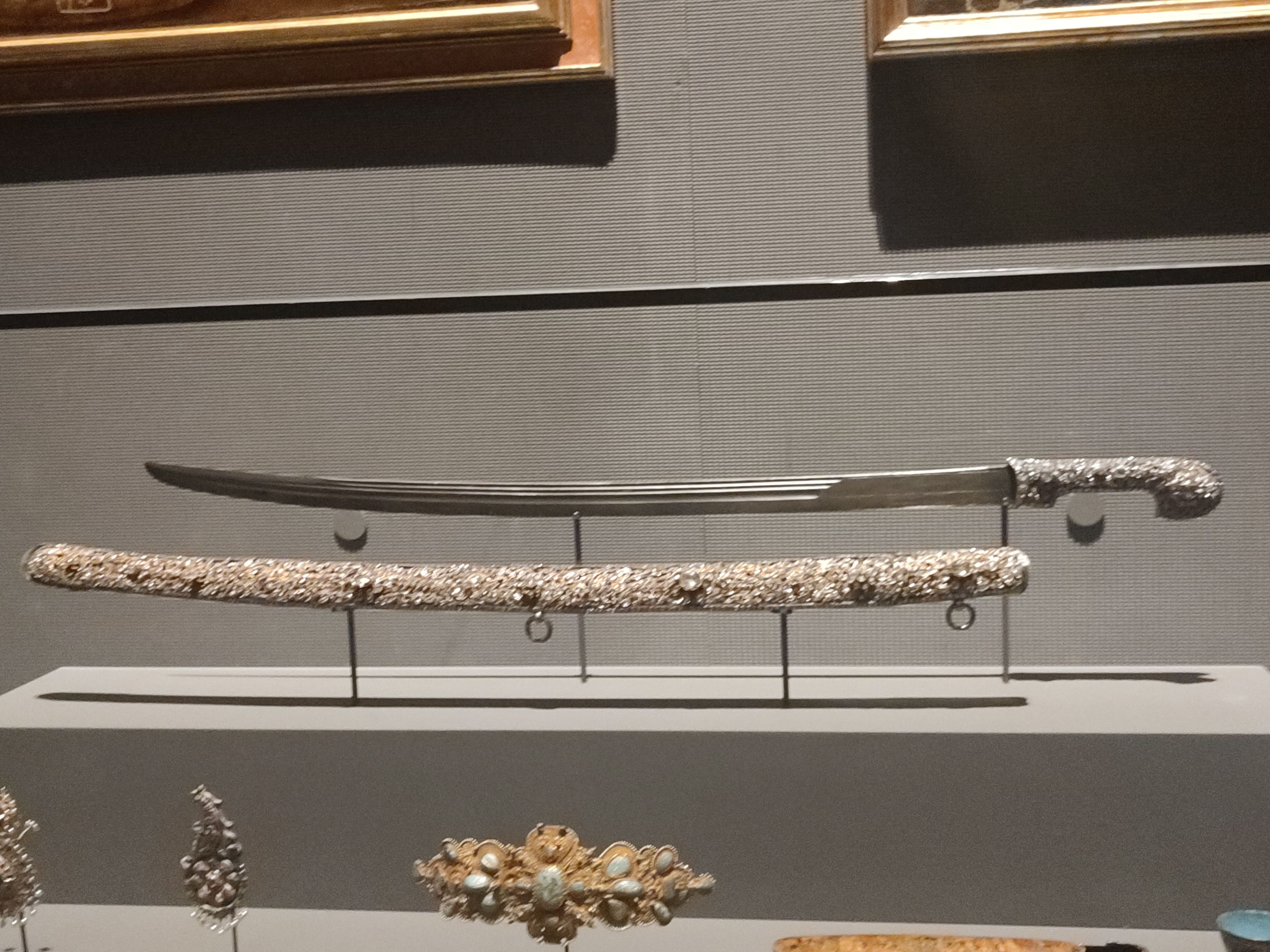 Ottoman period sword and cloak encrusted with gems.